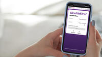Woman on cell phone using MyChart